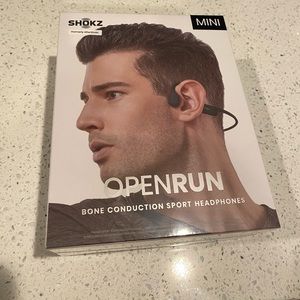 Brand new. Box never opened. Shokz mini Bluetooth headset. Black